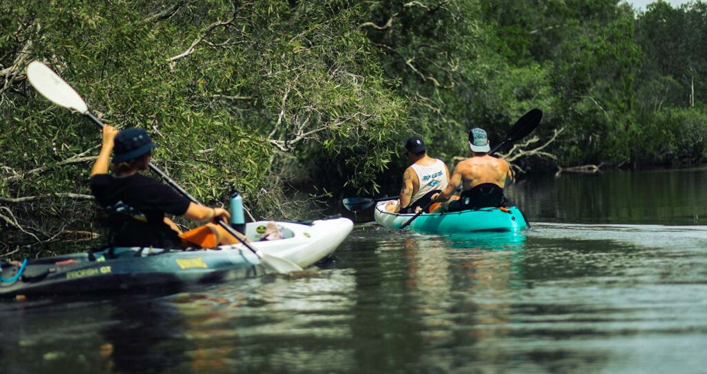 Why do kayakers throw their paddles