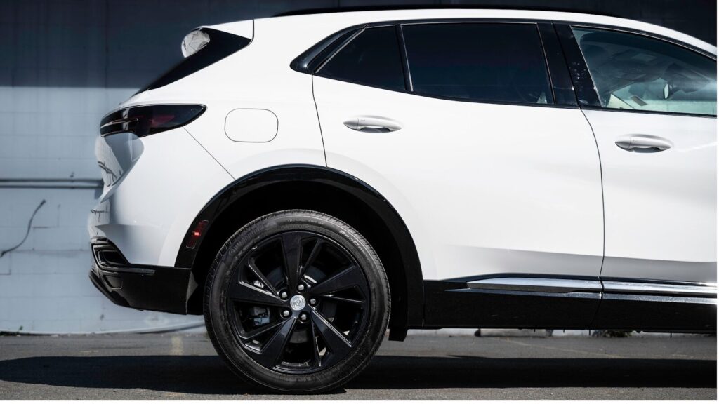 Best 5 Kayak Racks for Buick Envision a white suv parked in a parking lot
