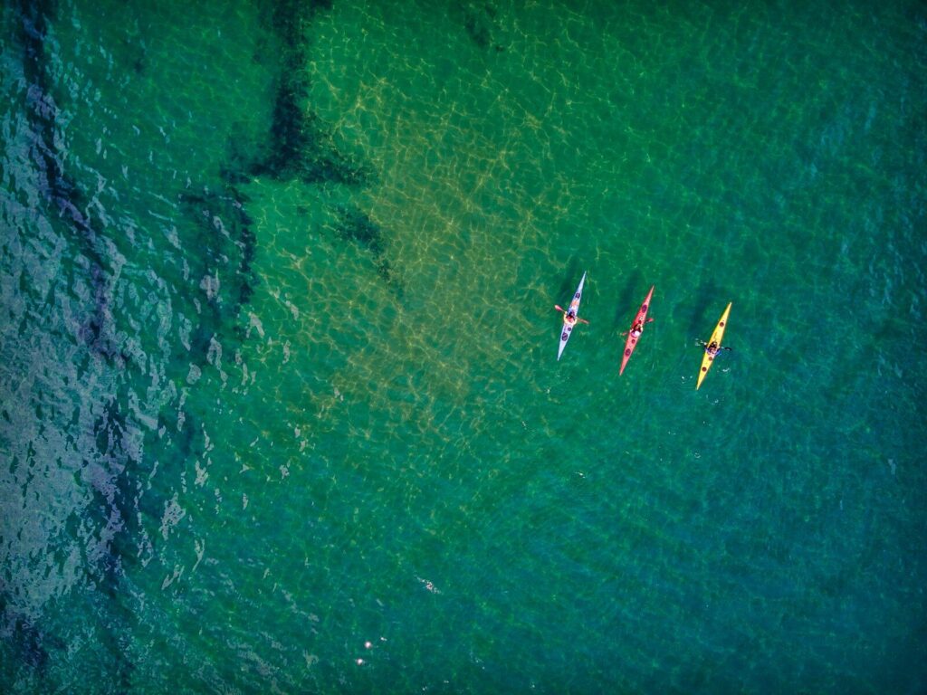 Best 5 Kayak under $300 aerial view of people riding boat on sea during daytime